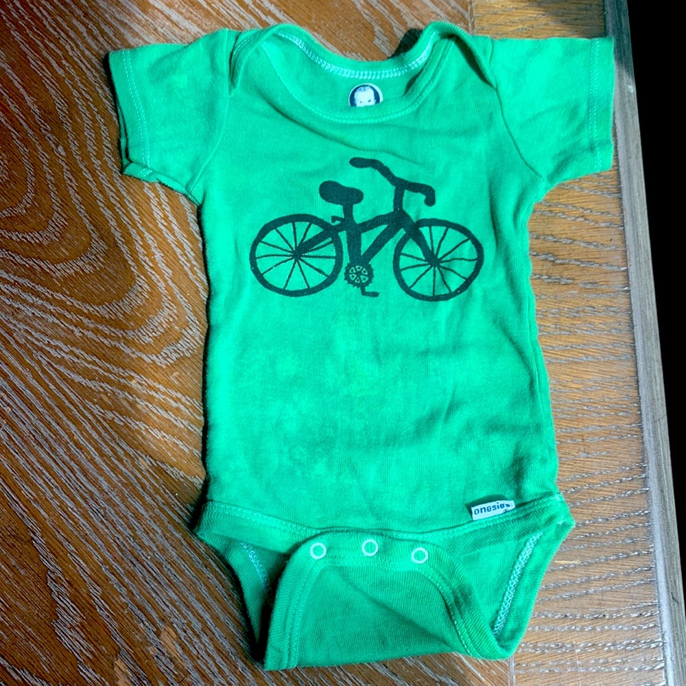 Hand dyed and printed baby bicycle onesie.
